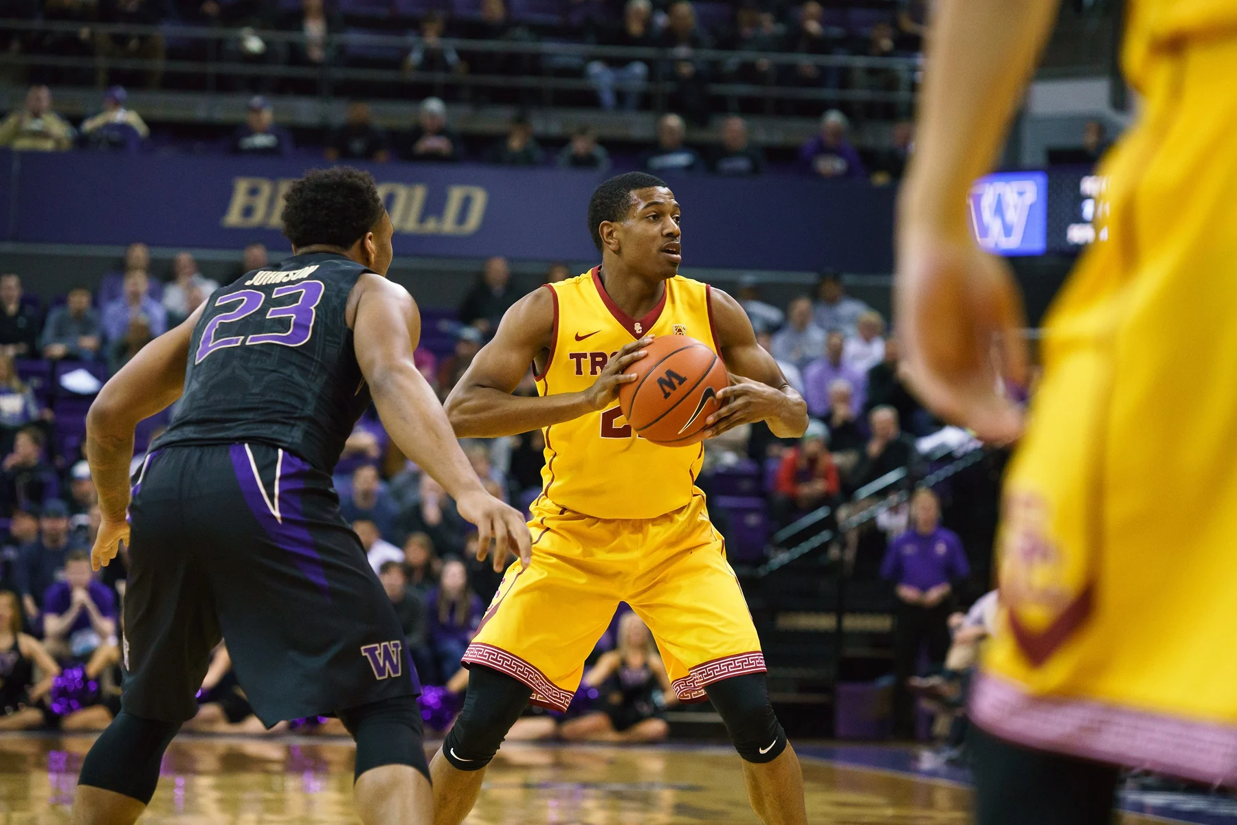 USC ball handler faces a Washington defender during a college basketball game