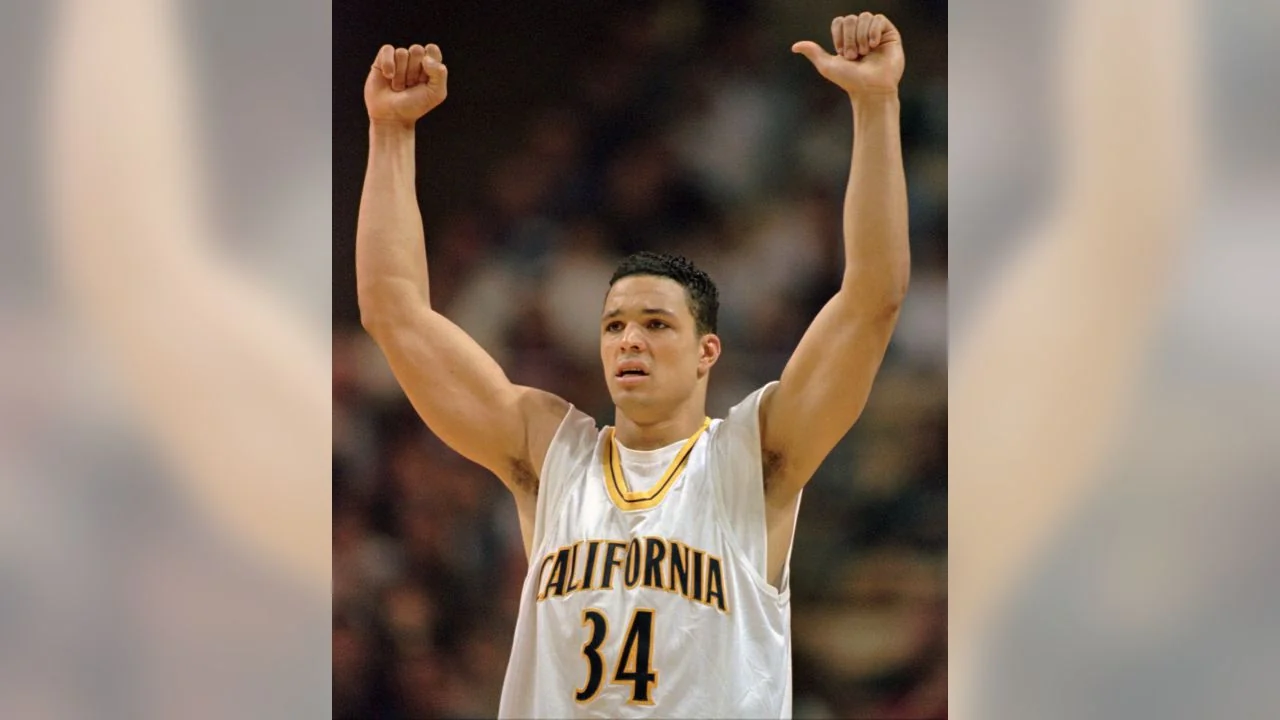 Tony Gonzalez raises his arms on court in a California basketball uniform