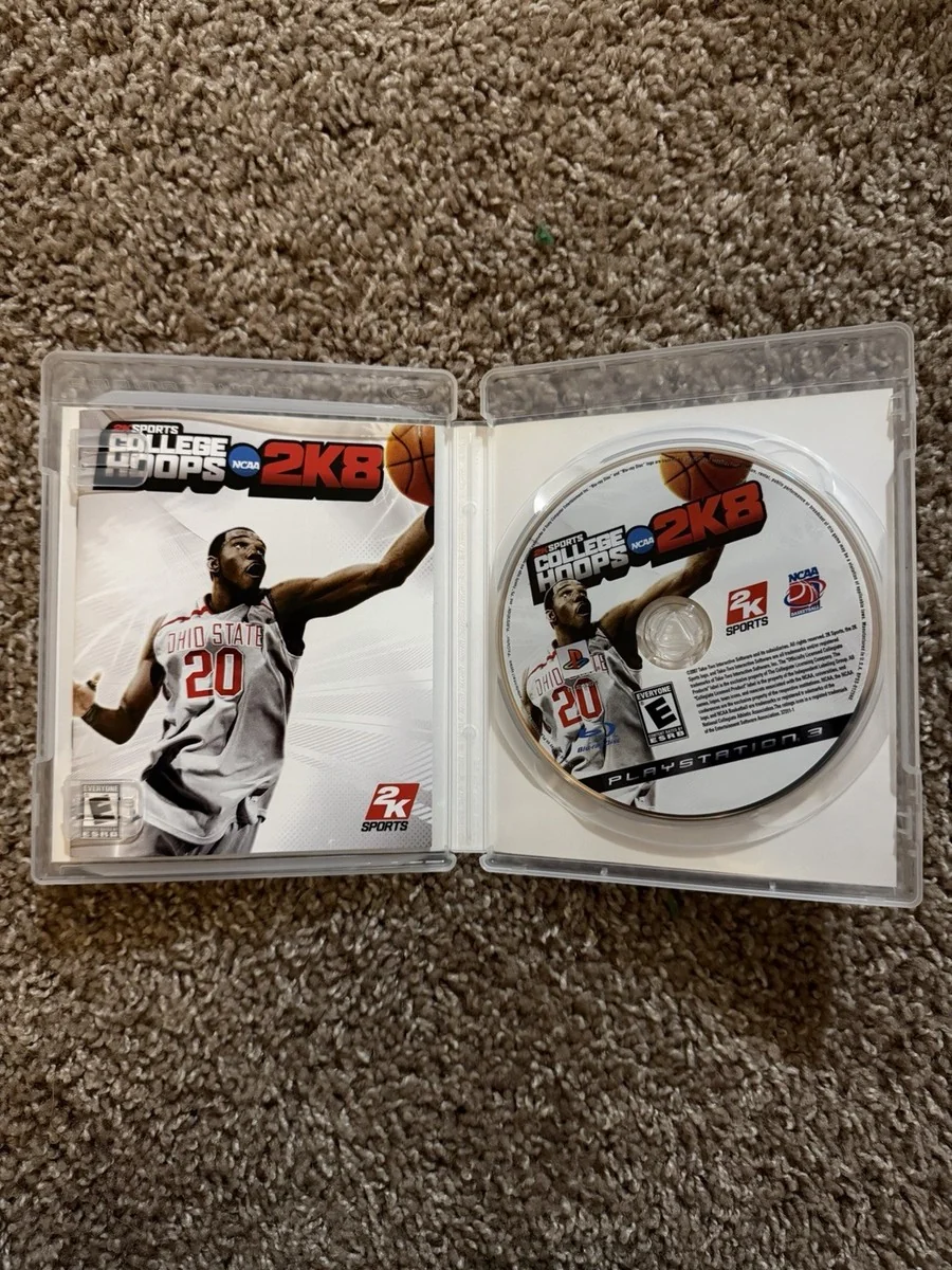An opened College Hoops 2K8 PlayStation 3 case with its game disc on carpet