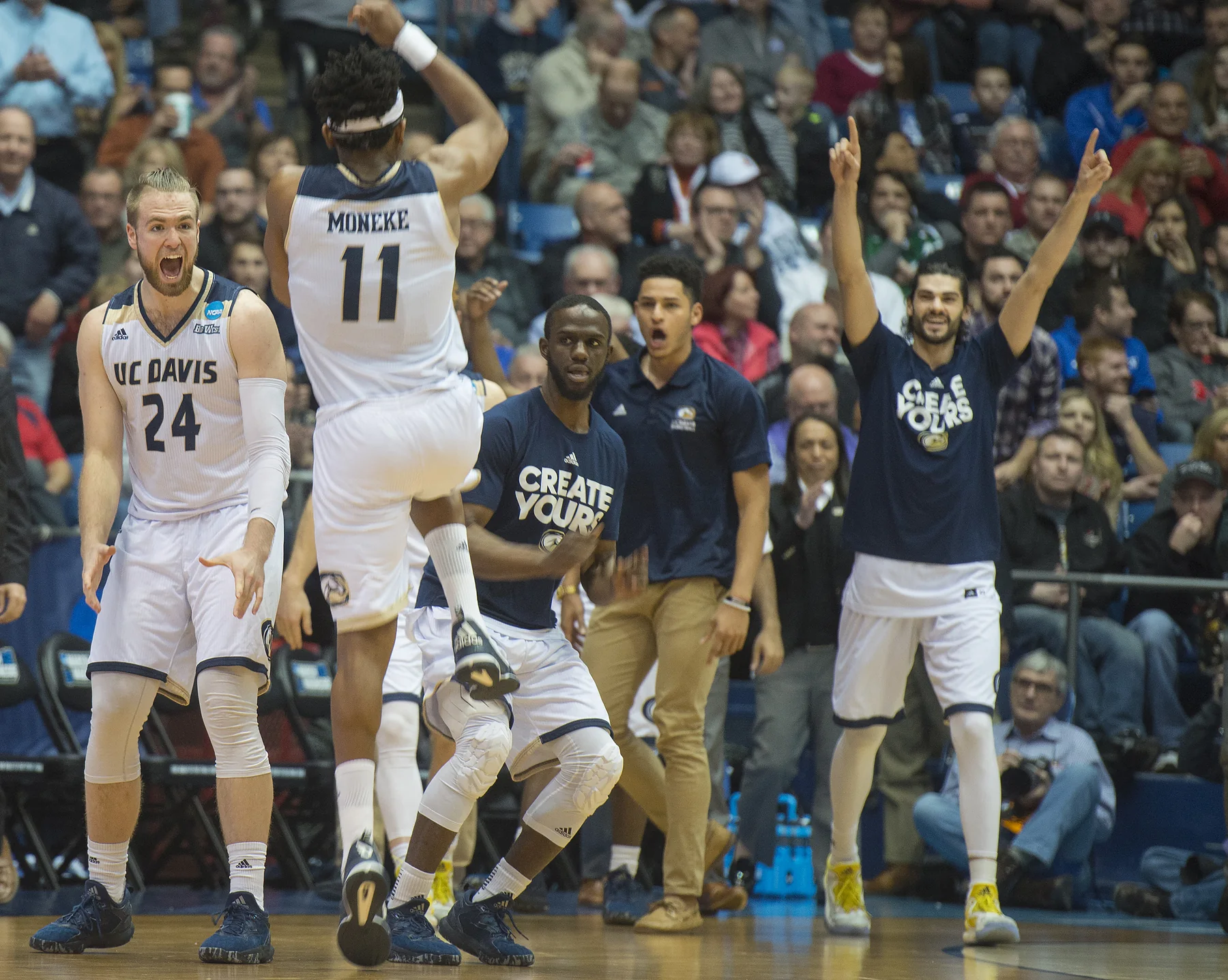 The UC Davis bench celebrates after winning an NCAA First Four game