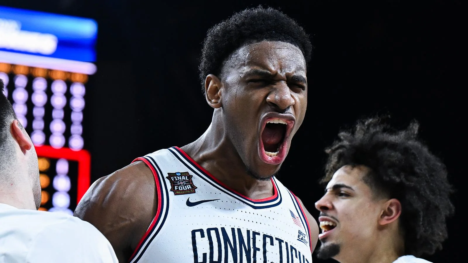 UConn players celebrate together in Final Four uniforms after the 2026 national semifinal