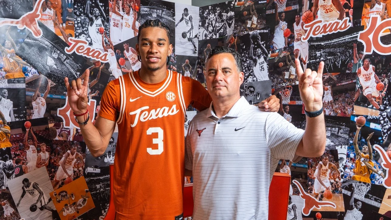 Elyjah Freeman and Sean Miller standing together during a Texas recruiting visit